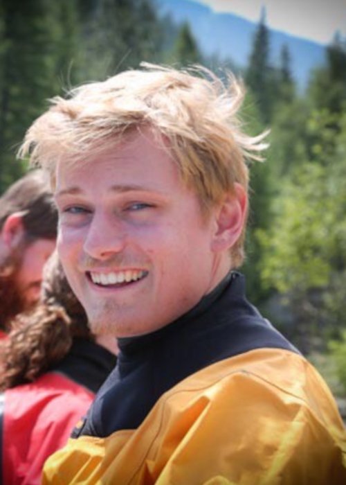 Idaho raft guide in yellow dry suit