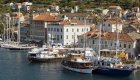 sail boats and yachts resting in harbor