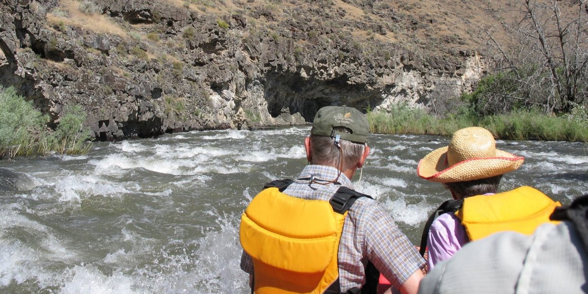 a couple white water rafting