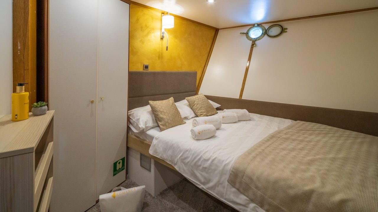Cabin of luxury yacht in Croatia with one twin bed made neatly.