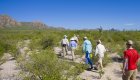 Group of tourists hiking through Carmen Isle