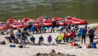 rafters sitting in circle on beach