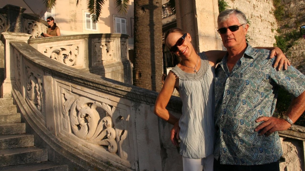 Two people smiling in historical Croatia.