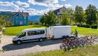 E-bikes being unloaded from a trailer attached to a white van in Idaho