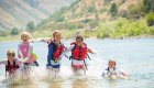 4 girls running through the water on the salmon river