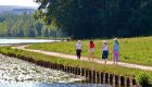 people walking along french canal