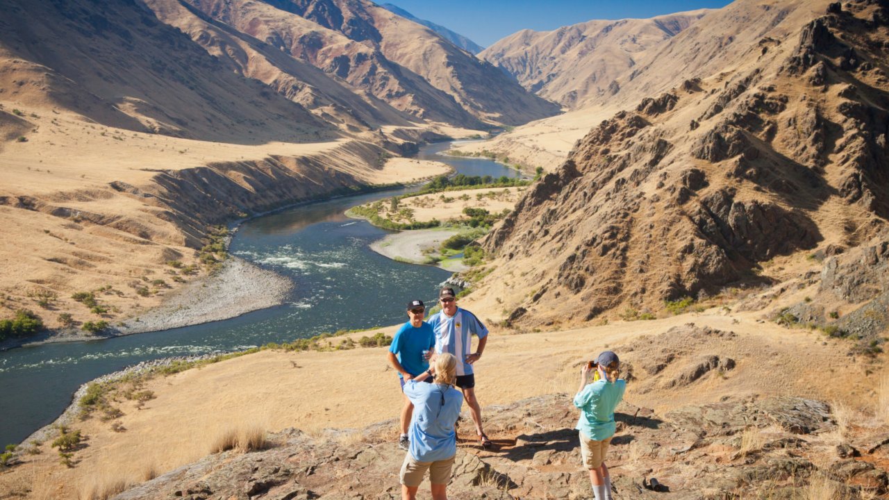 People posing for a photo after hiking up to Suicide Point along Hells Canyon