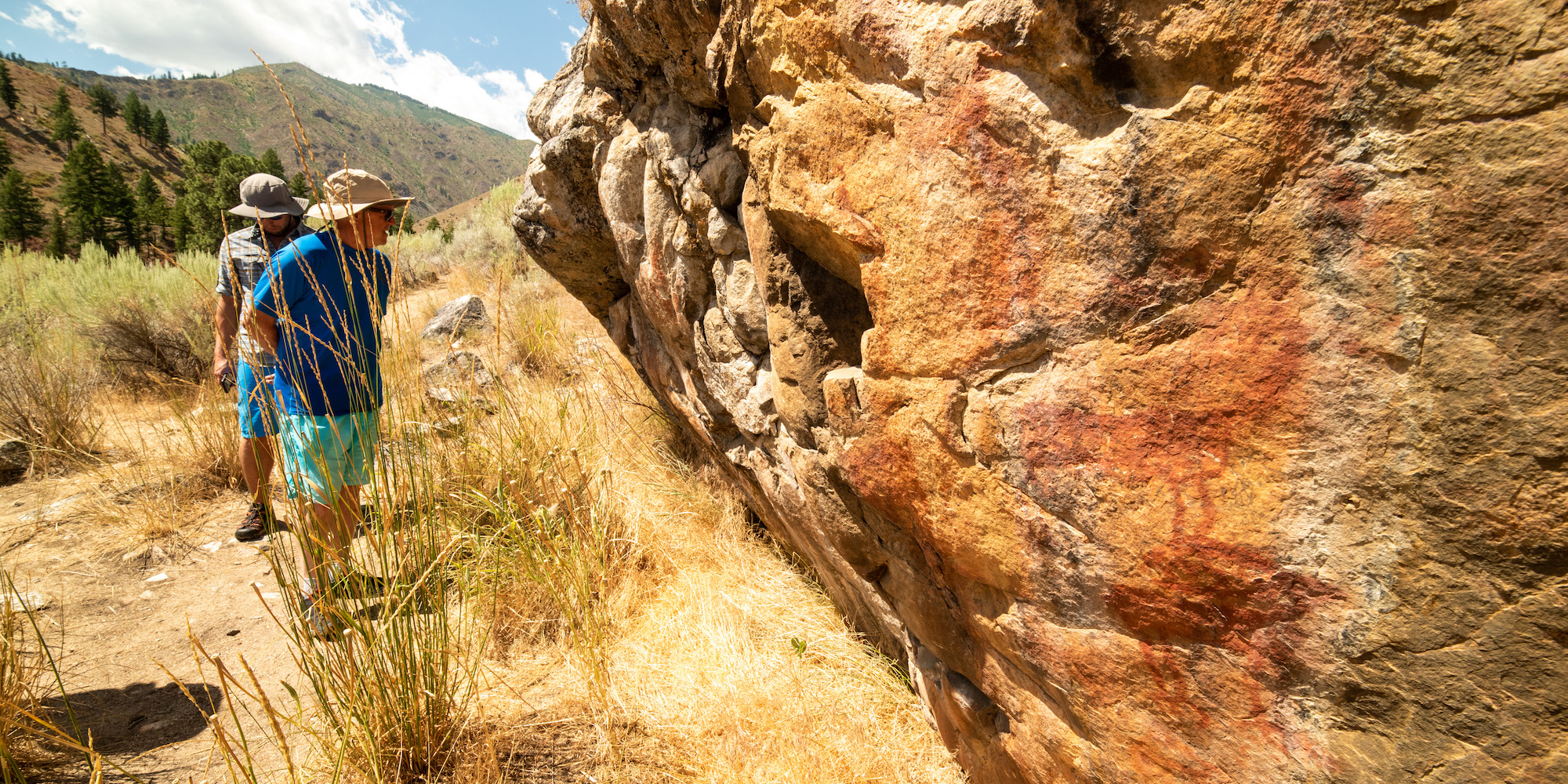 ROW Adventures guests observing petroglyphs along the Middle Fork Salmon River
