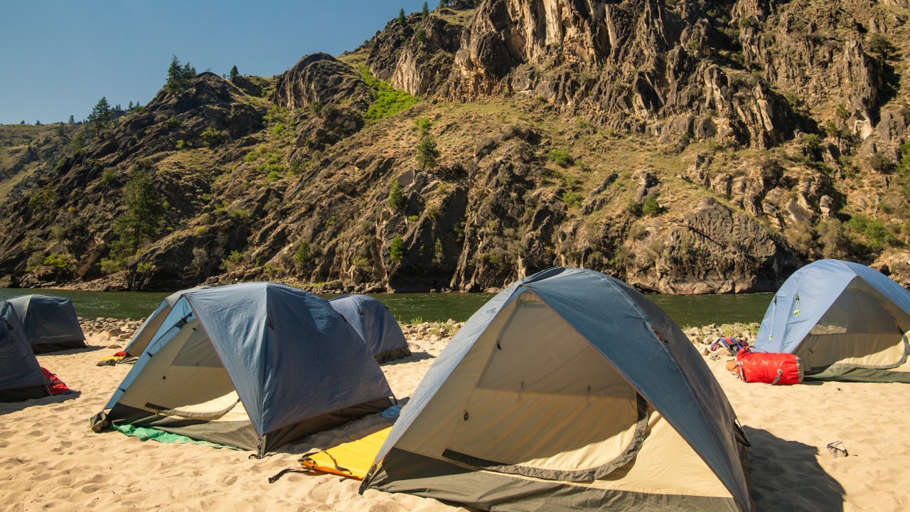 Tents set up on a sandy beach in Idaho