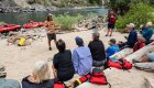 rafters sitting on a beach near rafts