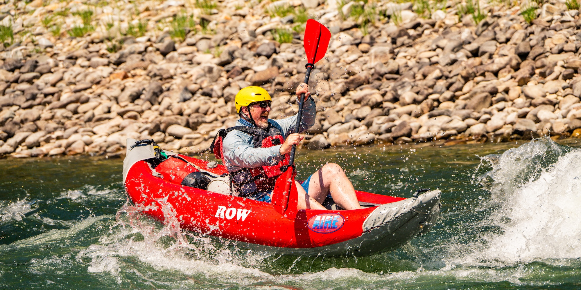 Kayaker riding rapids solo on the Main Salmon River, experiencing adrenaline-filled Salmon River rafting adventure
