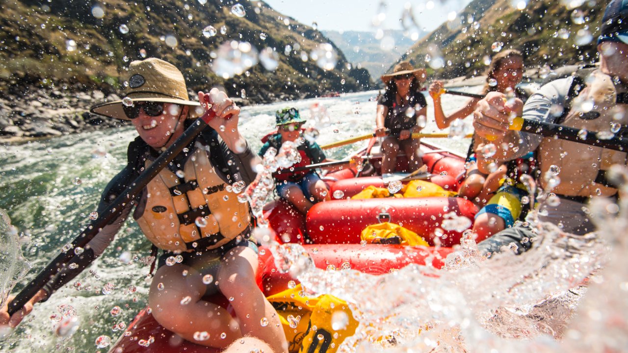 Guests paddling through a splashy rapid on the Lower Salmon River in Idaho