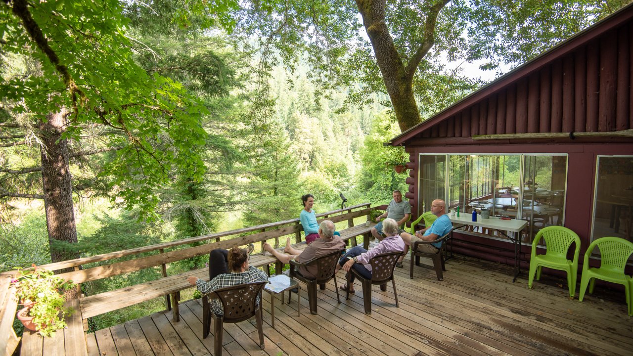 Guests enjoying the view from the porch at Marial Lodge, Oregon