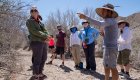 guide leading a group on a desert hike