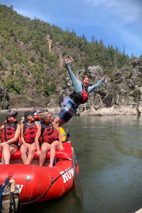 river guide jumping off red raft