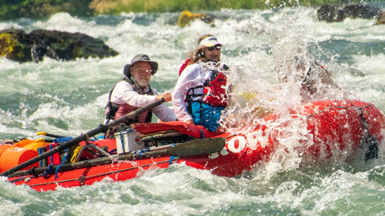 Red raft in splashy whitewater on the Deschutes River