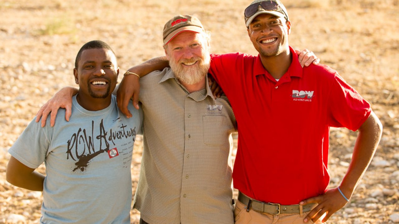 Peter visiting Namibia and our team of local Guides. three men standing arm and arm in namibia