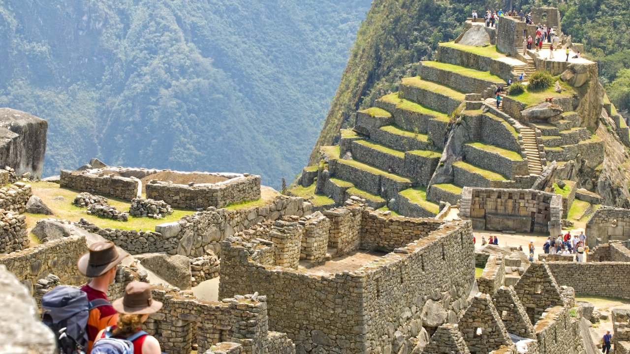 A couple hiking to the top of Machu Picchu