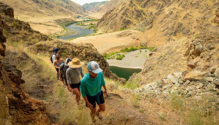 A group of hikers along the Snake River in Hells Canyon.