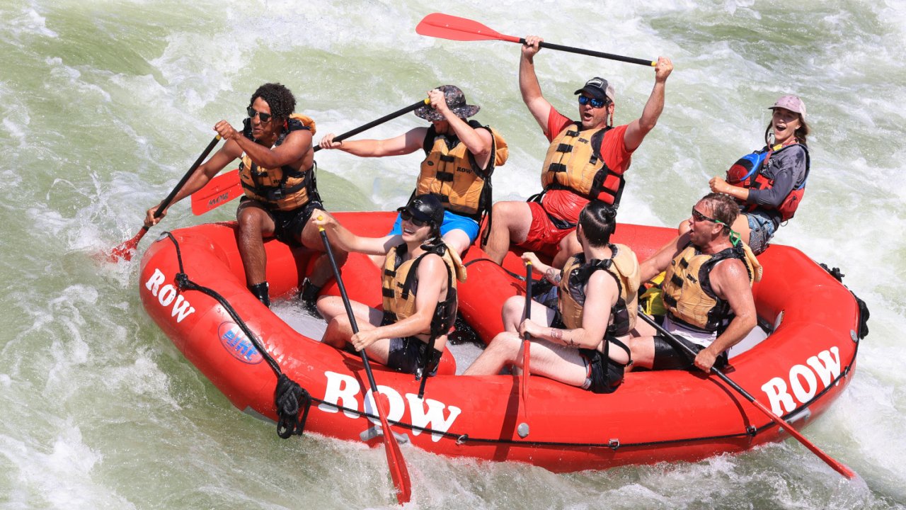 people in red raft on clark fork river