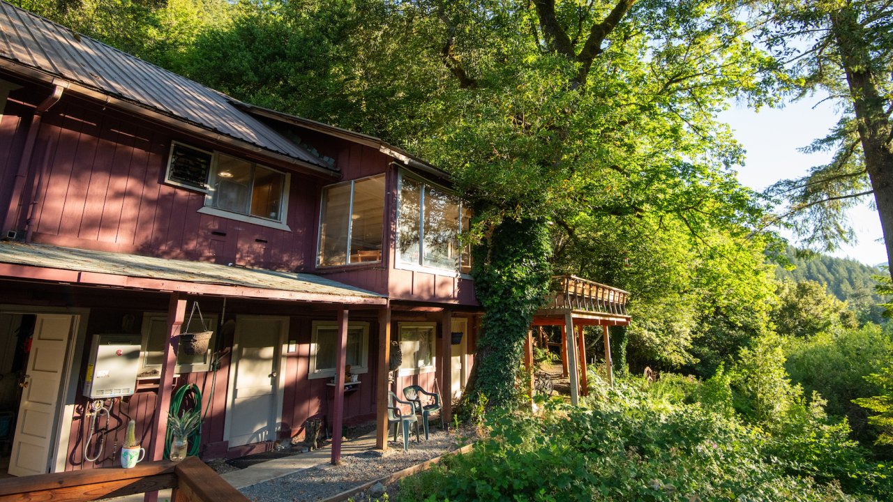 Exterior of one of the Rogue Wilderness Riverside lodges in Oregon