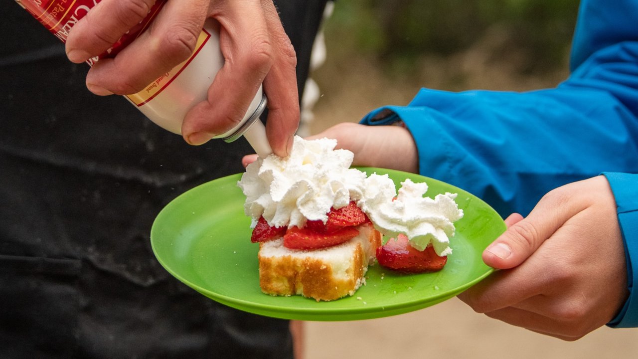 Strawberry and whipped cream desert made on a rafting adventure on the Snake river.