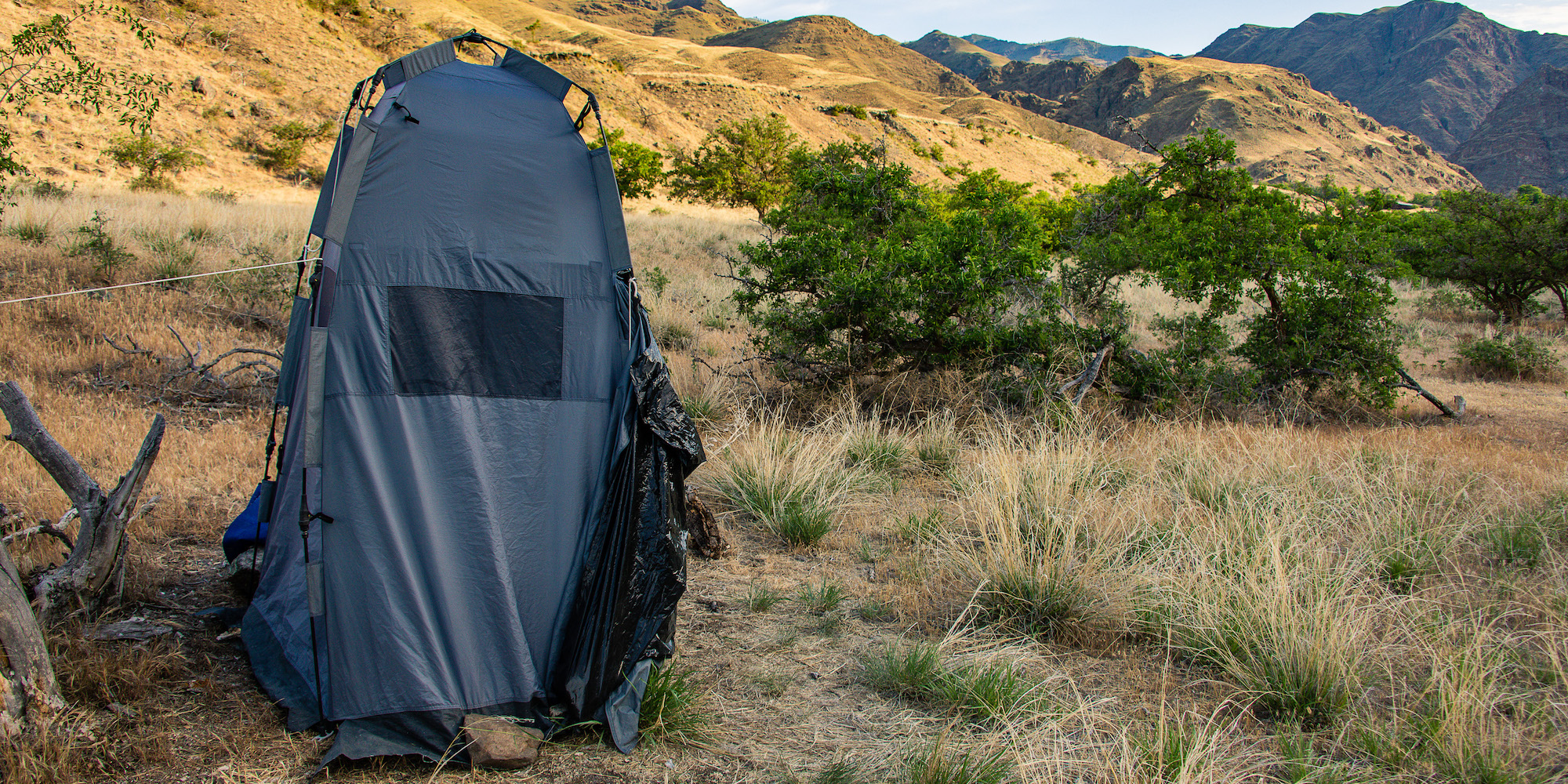 Bathroom tent with groover system inside for camping with ROW Adventures