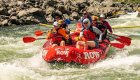 A view of customers in a ROW Adventures raft going through a rapid on the Snake River. 