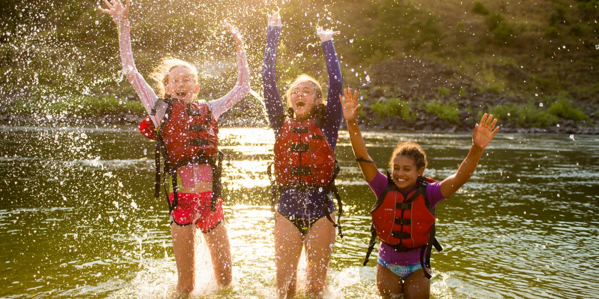 A group of kids plays in the water during our Family Magic Rafting trip on the Lower Salmon river