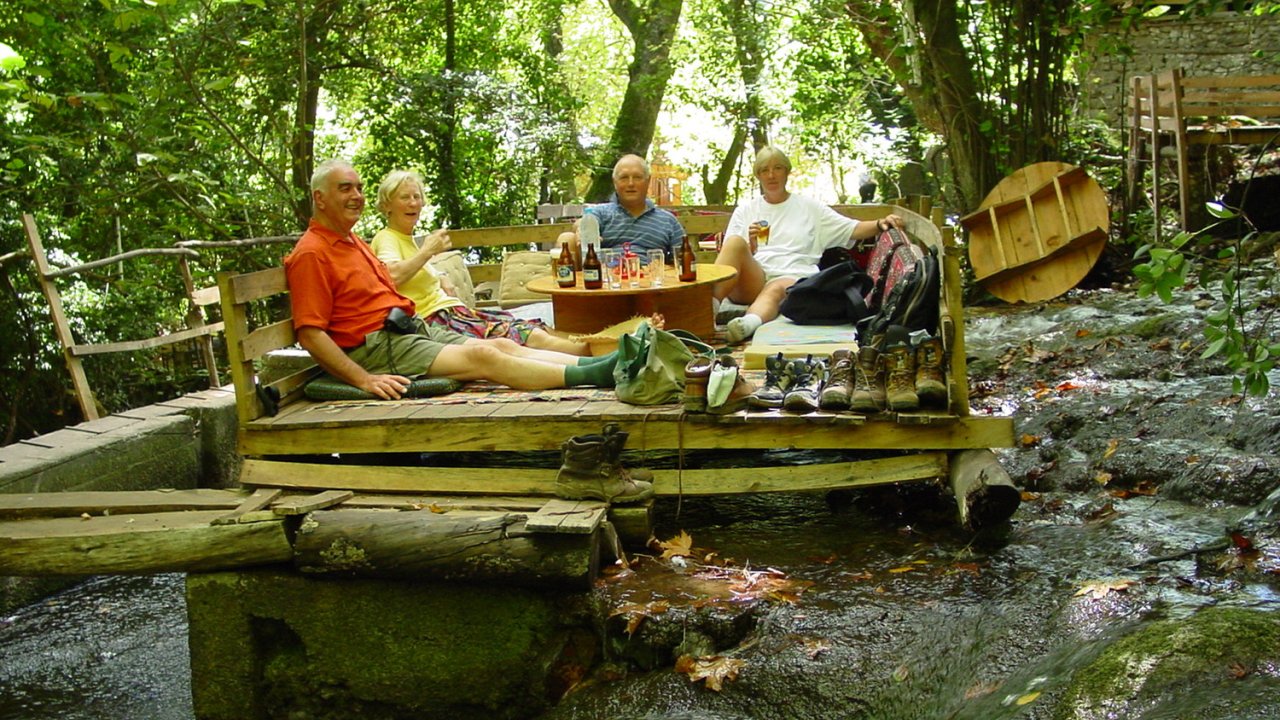 A group of people sitting outside and dining in Turkey