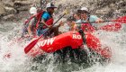 People paddling through a splashy rapid on the Salmon River