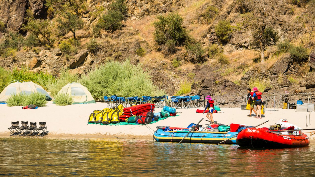rafting equipment set up on sandy beach