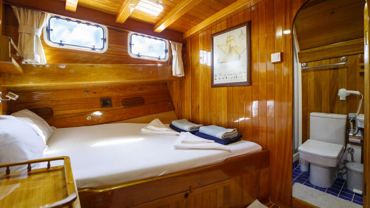 Queen bed room configuration aboard a small cruise yacht in Turkey